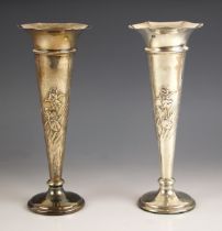 A pair of George V silver posy vases, William Comyns & Sons, London 1912, each with a flared rim,