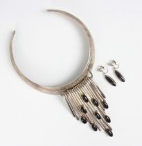 A 1980’s silver statement necklace, the waterfall style necklace with nine onyx coloured oval