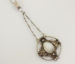 An Arts and Crafts style pendant, the organic shaped untested pearl within an openwork silver