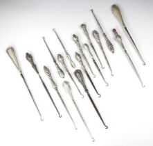 A selection of silver and silver plate mounted button hooks, including an example by Adie &