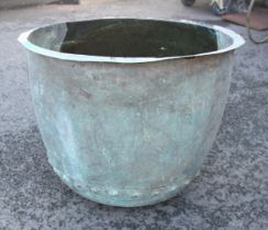 A large Victorian country house copper washing cauldron, of inverted bell form, with riveted seams