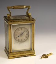 A French brass cased eight day repeating carriage clock, by Guy, Lamaille and Co,