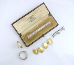 A 20th century style paste set bar brooch, the fourteen round cut white stones within silver