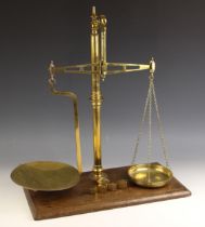 A set of brass beam scales by W & T Avery, early 20th century, the beam stamped with the makers name