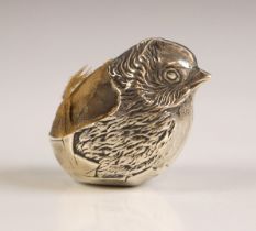 An Edwardian silver novelty pin cushion, Sampson Mordan Co, Chester 1907, modelled as a chick with