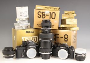A collection of Nikon 35mm camera equipment, comprising: a Nikon F2 Photomic 35mm SLR camera body,