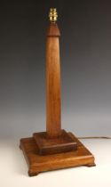 An Art Deco mahogany column table lamp, early to mid 20th century, the tapering square section