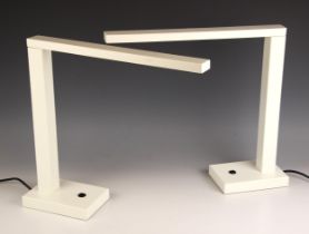 A pair of Chelsom 'Motion' steel desk lamps, with adjustable arm, matte white finish, with applied