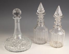 A near pair of Georgian decanters, each of mallet form, faceted body, triple knopped neck, each with