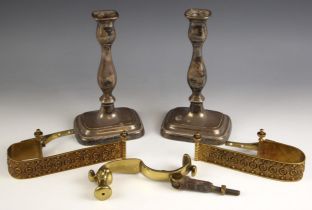 A pair of brass curtain tie backs, each decorated with continuous floral and foliate decoration,