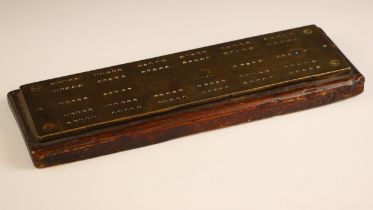 A cast brass cribbage board of large proportions, early 20th century, of typical form with punched