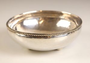 A George VI Arts and Crafts style silver bowl, Hugh Wallis, Chester 1948, the rope work rim above
