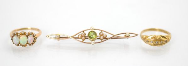 A selection of jewellery, to include an early 20th century opal and seed pearl ring, the three