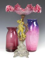 A Victorian gilt-spelter figural cranberry and clear glass comport, the cast base with a column