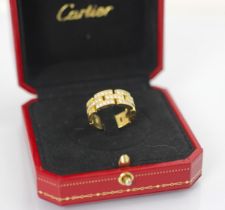 A Cartier Maillon Panthere diamond set ring, the thirty five round cut diamonds set within yellow