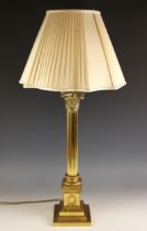 A brass column table lamp, late 20th century, the Corinthian capital raised on a reeded column set