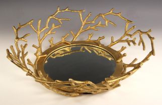 An Oka mirror, of circular form, the mirror surrounded by gilt metal branch decoration, 56cm wide