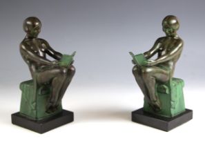 A pair of Max Le Verrier (French, 1891- 1973) Art Deco patinated metal book ends, titled '