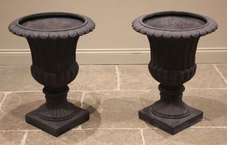 A pair of composite campana urns, early 21st century, each of typical fluted, inverted bell form,