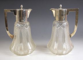 A pair of George V silver mounted decanters, Clark and Sewell, Chester 1919, the hinged cover with