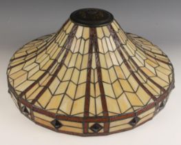 A Tiffany style stained glass ceiling light, of swept circular form with an all over geometric