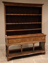 A George III oak dresser, probably North Walian, the moulded cornice over a plain frieze and three