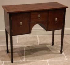 A George III mahogany dressing table, the rectangular crossbanded top over a central frieze drawer