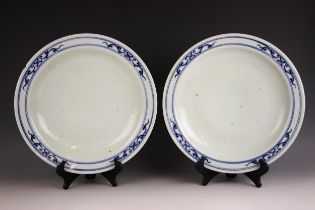 A pair of Chinese porcelain blue and white chargers, 19th century, each of large circular form and