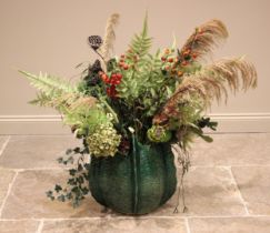 A contemporary floor vase of large proportions, modelled as a seed head, the green glazed body