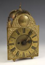 An 18th century brass lantern clock, the 11cm overhead saucer bell above the 15cm break arch brass