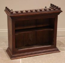 A Victorian Gothic revival pitch pine wall shelf in the Puginesque manner, the castellated cornice