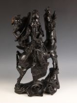 A large Japanese carved wood figural group, 20th century, depicting a warrior on horseback with