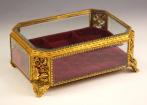 An ormolu filigree jewellery casket, 20th century, of rectangular form with canted corners, with