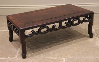 A Chinese rosewood opium table, the cleated rectangular top, with an openwork 'link' frieze, upon