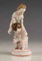 An Ernst Bohne Sohne porcelain 'leap frog' group, late 19th/ early 20th century, modelled as two