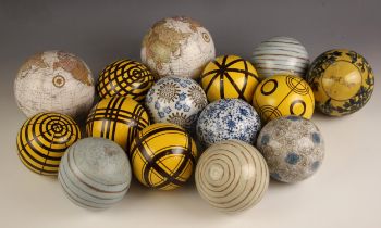 A selection of Oka decorative ceramic balls, containing a variety of designs including floral,
