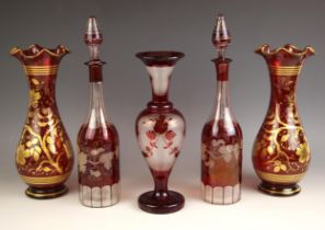 A pair of red glass vases, 20th century, each of baluster form with flared rim, the body decorated