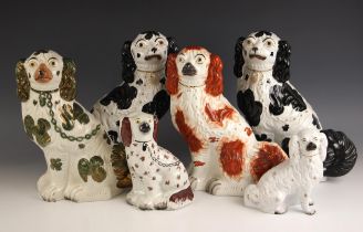 A quantity of Staffordshire King Charles Spaniel dogs, 19th century and later, to include: a pair of