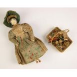 A Victorian peddlers (pedlar) peg doll, mid to late 19th century, modelled as a lady