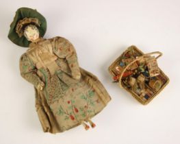 A Victorian peddlers (pedlar) peg doll, mid to late 19th century, modelled as a lady