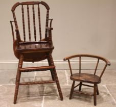 A primitive elm and ash child's chair, 19th century, with a stick back, shaped and figured elm