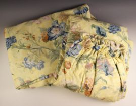 A pair of interlined curtains, each with floral design to a yellow ground, with cream cotton lining,