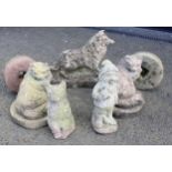 Five reconstituted stone garden ornaments, to include two cats and a dog, the tallest 33cm high,