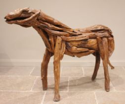A stylised equestrian sculpture of large proportions, 20th century, modelled from driftwood in the