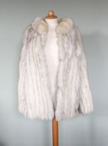 A hip length fur jacket, with satin embroidered lining, 'Made in Malta' label to interior, UK size