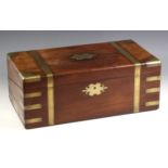 A 19th century mahogany brass bound stationery box, applied with a shaped brass cartouche,