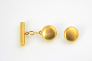 A yellow metal cufflink, of circular form with toggle back, with further cuff link (at fault)