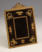 A French Empire style gilt metal mounted frame, late 19th or early 20th century, the gilt metal