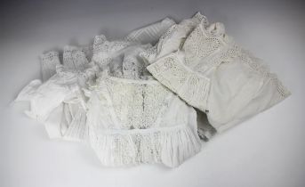 A late 19th century/early 20th century white cotton christening dress, with broderie anglaise centre