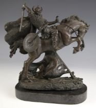 A patinated bronze sculpture of a Viking warrior, 20th century, modelled with sword raised on